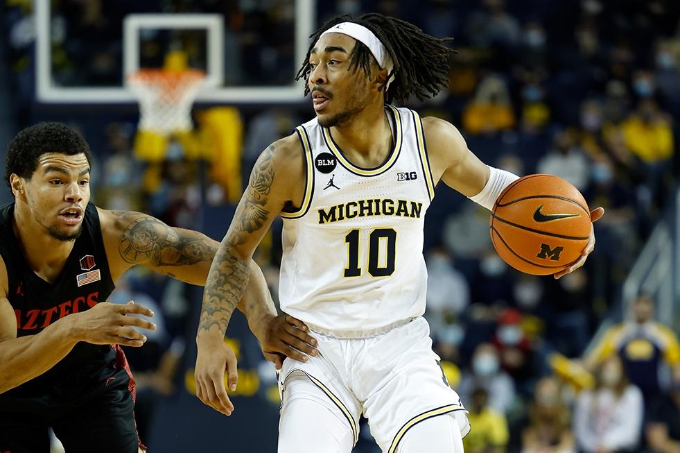 Michigan guard Frankie Collins dribbles on San Diego State's Matt Bradley. 