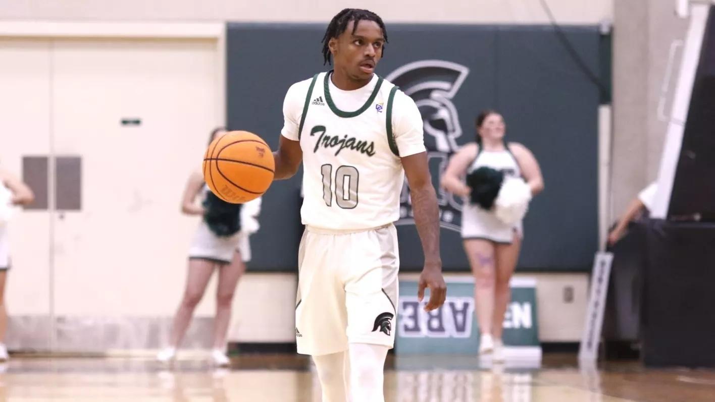 Chase Dawson dribbles up the court for Mount Olive. 