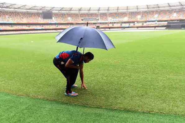 Bangladesh captain Mashrafe Mortaza checks the outfield at the Gabba that has been lashed by continuous rain.