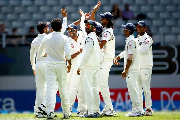 India celebrate the run out of Brendon McCullum.