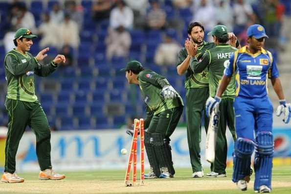 Shahid Afridi (centre) grabbed five wickets for 23 runs and then kept his cool in a batting crisis as Pakistan overcame Bangladesh by five wickets in the first one-day international in Dhaka on Thursday.