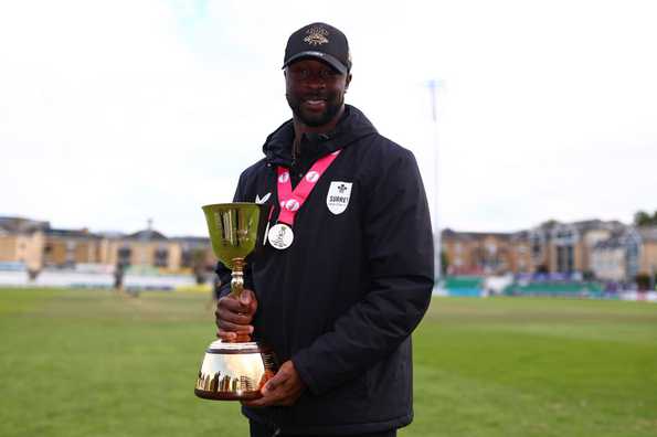 Kemar Roach poses with the trophy in Chelmsford