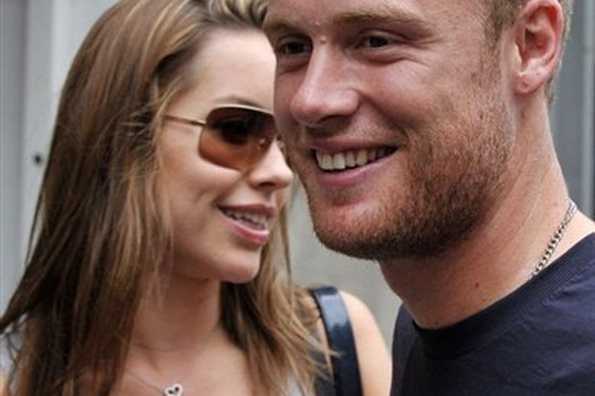 England all-rounder Andrew Flintoff (R) is pictured with his wife Rachael in central London in August. Flintoff was awarded an incremental contract by the England and Wales Cricket Board (ECB) for the next 12 months here on Friday.