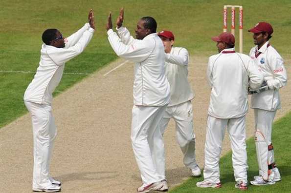 West Indies bowler Chris Gayle (2nd left) celebrates with team-mates after taking a wicket on the first day of the second NPower cricket Test match at Chester-le-Street. Essex pair Alastair Cook and Ravi Bopara batted England into a strong position on the first day of the second Test against the West Indies here at the Riverside.
