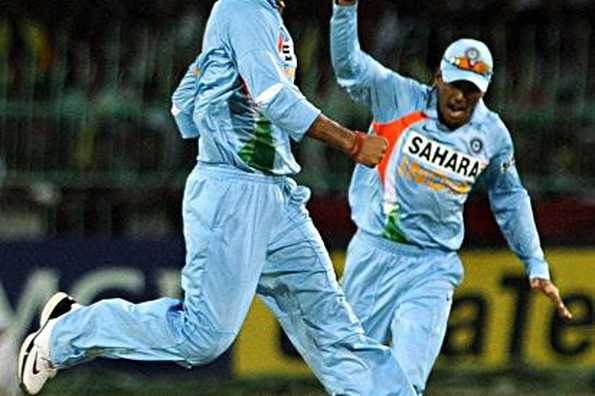 Indian cricketer Praveen Kumar (L) and teammate Subramaniam Badrinath (R) celebrate after the dismissal of Sri Lankan batsman Sanath Jayasuriya during the third One Day International (ODI) match between Sri Lanka and India at The R. Premadasa Stadium in Colombo. India won by 33 runs.