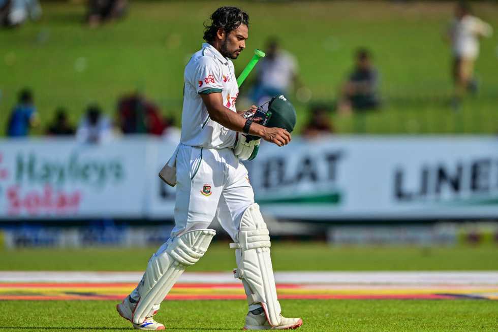 Najmul Hossain walks back after being dismissed 